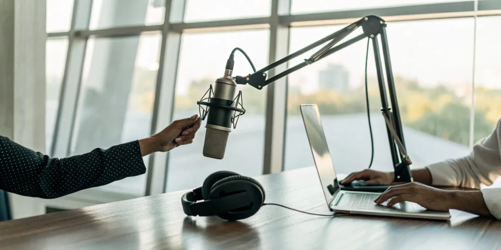 Blog 6 A microphone and headphones in a radio studio for getting your song on the radio.