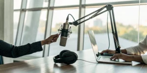 A microphone and headphones in a radio studio for getting your song on the radio.